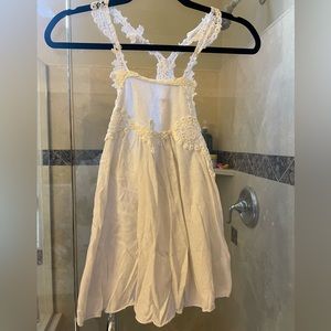 White free people tank top with flowers on it